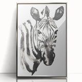 Framed acrylic wall art showcasing a striking zebra design with a silver frame, perfect for enhancing modern decor in living spaces or offices.