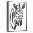 Framed canvas wall art featuring a striking black and white zebra design from the Animals A Wild Life collection, set against a sleek black frame, ideal for modern decor.