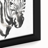 Close-up of a framed canvas artwork showcasing a striking zebra design, featuring bold black and white stripes, perfect for adding a wild touch to home decor.