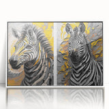 Framed wall art showcasing a striking zebra design in black and white, elegantly displayed in a sleek white frame, ideal for wildlife enthusiasts and modern decor.