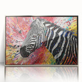 Framed wall art featuring a striking zebra design in a modern silver frame, showcasing bold black and white stripes that enhance any contemporary decor. Ideal for animal lovers and art enthusiasts looking to elevate their space with wildlife-inspired decor.