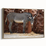Framed canvas wall art showcasing a striking zebra design in black and white, featuring a gold frame, perfect for adding a modern touch to any decor.