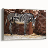 Framed wall art featuring a striking zebra design in black and white, set against a silver frame, ideal for adding a modern touch to home decor.