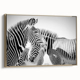 Framed wall art featuring a striking zebra design on a textured canvas, accented with gold tones, perfect for adding a contemporary touch to any living space.
