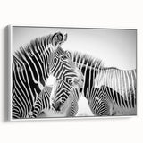 Framed canvas wall art featuring a striking zebra design, showcasing bold black and white stripes, perfect for adding a modern touch to home decor.