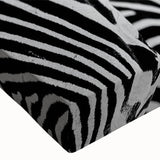 Close-up of a vibrant zebra design stretched canvas wall art piece, showcasing intricate black and white stripes with a textured finish, perfect for wildlife-themed decor.