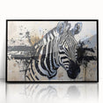 Framed wall art featuring a striking zebra design in bold black and white, set against a sleek acrylic background, ideal for animal lovers and modern decor.