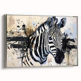 Framed canvas wall art showcasing a striking zebra design in black and white, elegantly displayed in a silver frame, perfect for adding a touch of wildlife artistry to home decor.