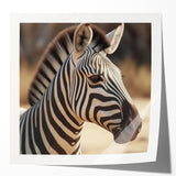 Stylish wall art featuring a vibrant zebra design, showcasing bold black and white stripes on a glossy surface, perfect for animal lovers and modern decor.