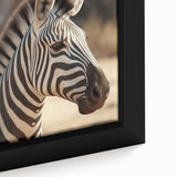 Close-up of a framed canvas wall art featuring a striking zebra design, showcasing intricate black and white stripes, perfect for modern home decor and wildlife enthusiasts.