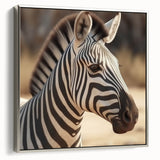 Framed wall art featuring a striking zebra design in black and white, set against a silver background, showcasing a modern aesthetic perfect for wildlife enthusiasts.