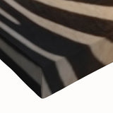 Close-up of a vibrant zebra design wall art canvas, showcasing intricate black and white stripes, perfect for adding a wild aesthetic to home decor.