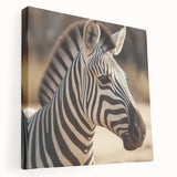 Stretched canvas wall art featuring a close-up of a striking zebra design, showcasing intricate black and white stripes, perfect for animal lovers and modern decor.