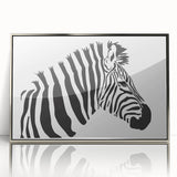 Framed wall art featuring a striking zebra design in black and white, elegantly displayed with a silver frame, perfect for adding a modern touch to any room decor.