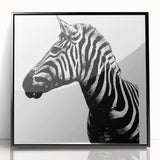 Framed acrylic wall art showcasing a striking zebra design in black and white, ideal for adding a modern touch to any home decor. Perfect for animal lovers and art enthusiasts.