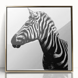 Framed wall art showcasing a striking zebra design in bold black and white colors, featuring an elegant gold acrylic frame, perfect for modern home decor.