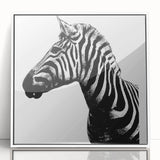 Framed acrylic wall art featuring a striking zebra design in black and white, perfect for modern decor. Ideal for animal lovers and wildlife enthusiasts.