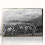 Framed wall art featuring a striking zebra design set against a gold-accented background, perfect for adding a touch of wildlife elegance to any modern decor.