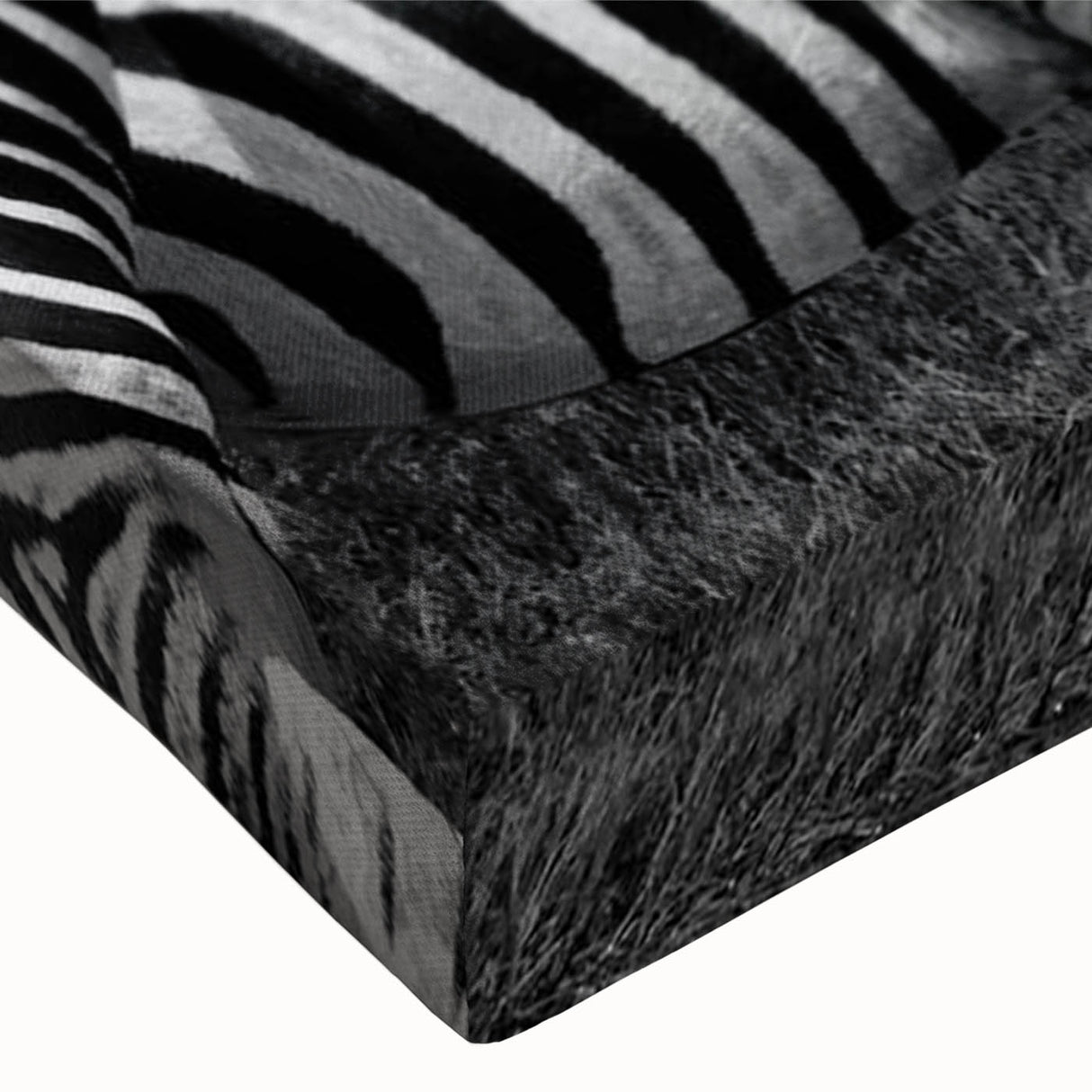 Close-up of a vibrant zebra design on stretched canvas, showcasing intricate black and white stripes, ideal for animal-themed decor in modern interiors.