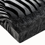 Close-up of a vibrant zebra design on stretched canvas, showcasing intricate black and white stripes, ideal for animal-themed decor in modern interiors.