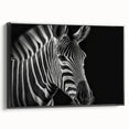 Framed canvas wall art featuring a striking black and white zebra design, showcasing intricate details and textures, perfect for wildlife enthusiasts and modern decor.