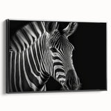 Framed canvas wall art featuring a striking black and white zebra design, showcasing intricate details and textures, perfect for wildlife enthusiasts and modern decor.
