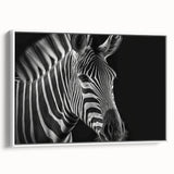 Framed canvas wall art featuring a striking zebra design in black and white, set against a minimalist backdrop, ideal for modern home decor. Perfect for animal lovers and safari enthusiasts seeking unique wildlife art.