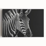 Front view of a stretched canvas wall art featuring a striking zebra design, showcasing bold black and white stripes, ideal for adding a dynamic touch to home decor.