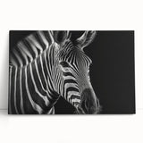 Stretched canvas wall art showcasing a vibrant zebra design, featuring bold black and white stripes against a light background, perfect for animal lovers' decor.