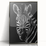 Framed wall art featuring a striking zebra design in black and white, showcasing intricate patterns and textures, perfect for animal lovers and modern decor.