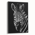 Framed wall art featuring a striking zebra design in black and white, showcasing intricate details and textures, perfect for animal lovers and modern decor.