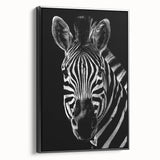 Framed wall art featuring a striking zebra design in black and white, showcasing intricate details and textures, perfect for animal lovers and modern decor.