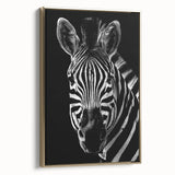 Framed canvas wall art showcasing a striking zebra design with bold black and white stripes, elegantly displayed against a gold background, perfect for animal lovers.