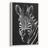 Framed canvas wall art showcasing a striking zebra design against a white background, ideal for enhancing modern interior decor with wildlife themes.