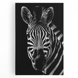 Stretched canvas wall art depicting a striking black and white zebra design, ideal for animal lovers and nature-themed decor. Perfect for enhancing any living space.
