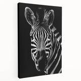 Zebra-themed wall art featuring a striking black and white design, printed on stretched canvas, showcasing detailed textures and vibrant colors, ideal for home decor.