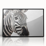 Framed acrylic wall art featuring a striking zebra design, showcasing vibrant black and white stripes, perfect for enhancing modern decor with a touch of wildlife.