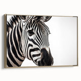Framed canvas wall art featuring a striking zebra design in a gold frame, showcasing intricate details and vibrant colors, ideal for wildlife decor in modern interiors.