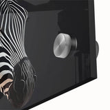 Close-up of an artistic zebra design wall art piece, showcasing vibrant black and white stripes on clear acrylic glass, ideal for wildlife-themed decor.