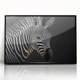 Framed wall art featuring a striking black and white zebra design, showcasing intricate details and textures in a modern acrylic frame, ideal for wildlife enthusiasts.