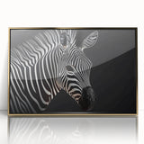 Framed wall art featuring a striking zebra design with gold accents, showcasing a contemporary style perfect for modern home decor. The artwork captures the beauty of wildlife, making it an ideal statement piece for animal lovers and interior enthusiasts alike.