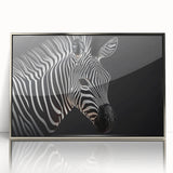 Framed wall art featuring a sleek, silver-acrylic design of a zebra, showcasing intricate details and vibrant colors, perfect for modern home decor.