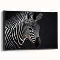 Framed canvas wall art of a zebra design, showcasing bold black and white stripes against a sleek background, perfect for modern home decor.