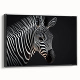 Framed canvas wall art of a zebra design, showcasing bold black and white stripes against a sleek background, perfect for modern home decor.
