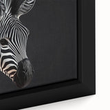 Close-up of a framed canvas depicting a striking zebra design, showcasing intricate black and white stripes, ideal for wildlife-themed home decor. Perfect for animal lovers seeking unique wall art.