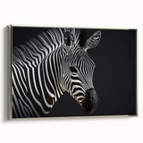 Framed canvas wall art featuring a striking zebra design in a silver frame, showcasing intricate black and white patterns, perfect for wildlife-themed decor.
