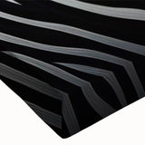 Close-up of a vibrant zebra design stretched canvas wall art piece, showcasing intricate black and white stripes, ideal for adding a wild aesthetic to modern decor.