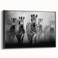 Framed canvas wall art showcasing a striking zebra design in black and white, displayed from the side to highlight its modern aesthetic and sleek finish. Perfect for animal lovers and contemporary decor enthusiasts looking to elevate their home or office space.