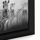Close-up of a framed canvas wall art featuring a vibrant zebra design, showcasing intricate details and bold colors, perfect for adding a wildlife touch to home decor.