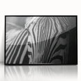 Framed wall art featuring a striking black and white zebra design, showcasing intricate details and textures, perfect for enhancing modern home decor.